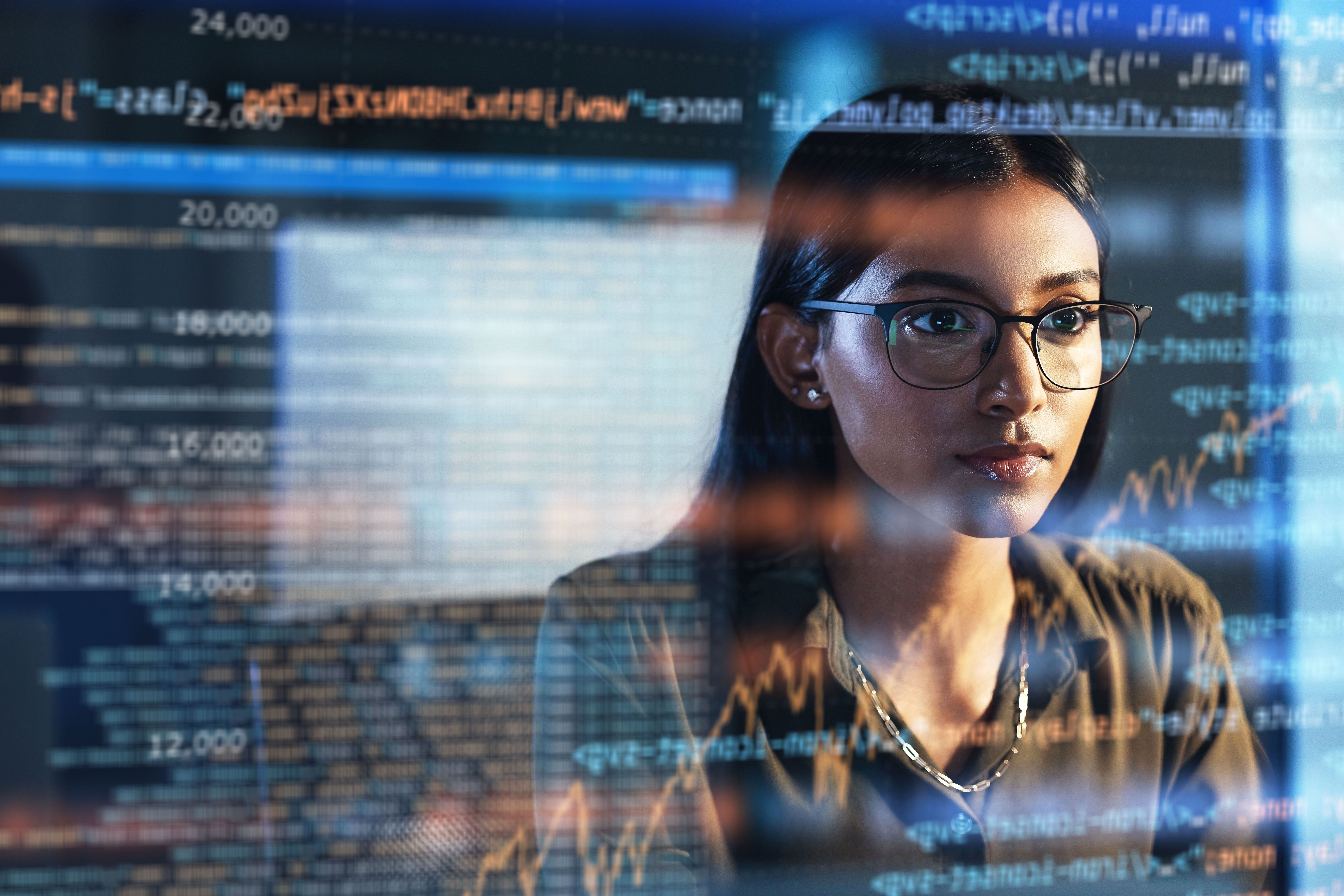 Professional woman looking at a screen of research data